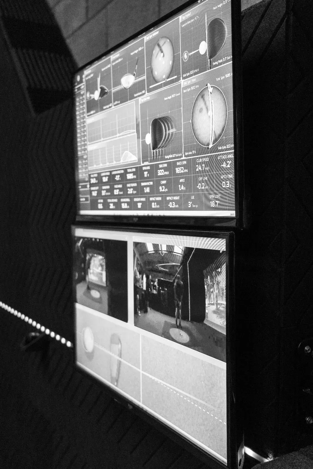 Shot-analysis monitors at a Virtual Fairways simulator bay